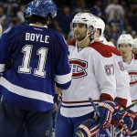 
              Tampa Bay Lightning center Brian Boyle (11) shakes hands with Montreal Canadiens left wing Max Pacioretty (67) after the Lightning defeated the Canadiens 4-1 during Game 6 of a second-round NHL Stanley Cup hockey playoff series Tuesday, May 12, 2015, in Tampa, Fla. The Lightning eliminated the Canadiens. (AP Photo/Chris O'Meara)
            