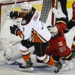 
              Anaheim Ducks' Andrew Cogliano, left, celebrates his tying goal as Calgary Flames goalie Karri Ramo, from Finland, picks himself up during the second period of Game 4 of NHL hockey second-round playoff action in Calgary, Alberta, Friday, May 8, 2015. (Jeff McIntosh/The Canadian Press via AP) MANDATORY CREDIT
            