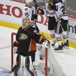 
              Anaheim Ducks goalie Frederik Andersen, bottom, looks away as Chicago Blackhawks left wing Brandon Saad, right, celebrates his goal with his teammates during the second period in Game 7 of the Western Conference final of the NHL hockey Stanley Cup playoffs in Anaheim, Calif., Saturday, May 30, 2015.  (AP Photo/Mark J. Terrill)
            