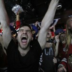
              Chicago Blackhawks fans celebrate in the Wrigleyville neighborhood of Chicago after the Chicago Blackhawks defeated the Tampa Bay Lightning to win the NHL hockey Stanley Cup, Monday, June 15, 2015. (AP Photo/Christian K. Lee)
            