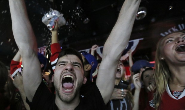 Chicago Blackhawks fans celebrate in the Wrigleyville neighborhood of Chicago after the Chicago Bla...
