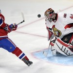 
              Ottawa Senators goalie Craig Anderson (41) stops Montreal Canadiens center Tomas Plekanec (14) during the second period of Game 5 of a first-round NHL hockey playoff series, Friday, April 24, 2015, in Montreal. (Ryan Remiorz/The Canadian Press via AP)
            