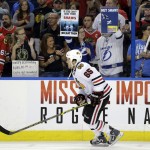 
              A fans hold up a signs regarding the alleged bite of Tampa Bay Lightning defenseman Victor Hedman by Chicago Blackhawks center Andrew Shaw in Game 1, before Game 2 of the NHL hockey Stanley Cup Final in Tampa, Fla., Saturday, June 6, 2015.  (AP Photo/Chris O'Meara)(AP Photo/Chris O'Meara)
            