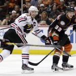 
              Chicago Blackhawks center Jonathan Toews, left, shoots around Anaheim Ducks right wing Jakob Silfverberg during the third period in Game 7 of the Western Conference final of the NHL hockey Stanley Cup playoffs in Anaheim, Calif., Saturday, May 30, 2015.  (AP Photo/Jae C. Hong)
            