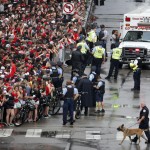 
              Chicago Blackhawks' fans occupy the corner of Michigan Ave and Monroe before the parade to celebrate the Blackhawks' Stanley Cup win over the Tampa Bay Lightning, Thursday, June 18, 2015, in Chicago, Ill. (AP Photo/Charles Rex Arbogast)
            
