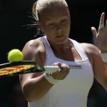 
              Kiki Bertens of the Netherlands returns a ball to Petra Kvitova of the Czech Republic during the singles first round match at the All England Lawn Tennis Championships in Wimbledon, London, Tuesday June 30, 2015. (AP Photo/Tim Ireland)
            
