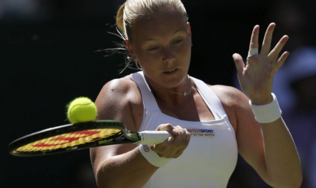 Kiki Bertens of the Netherlands returns a ball to Petra Kvitova of the Czech Republic during the si...