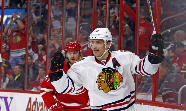 FILE – In this March 23, 2015, file photo, Chicago Blackhawks’ Patrick Sharp (10) celeb...