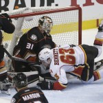 
              Calgary Flames' Sam Bennett, front, collides with Anaheim Ducks goalie Frederik Andersen, of Denmark, during the first period of Game 1 in the second round of the NHL Stanley Cup hockey playoffs, Thursday, April 30, 2015, in Anaheim, Calif. (AP Photo/Jae C. Hong)
            