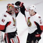 
              Ottawa Senators goalie Craig Anderson (41) is congratulated by right wing Curtis Lazar (27) after the Senators defeated the Montreal Canadiens 5-1 in Game 5 of a first-round NHL hockey playoff series, Friday, April 24, 2015, in Montreal. (Ryan Remiorz/The Canadian Press via AP)
            