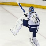 
              Tampa Bay Lightning goalie Ben Bishop reacts as time winds off the clock to give the Lightning a 2-0 win over the New York Rangers in Game 7 of the Eastern Conference final during the NHL hockey Stanley Cup playoffs, Friday, May 29, 2015, in New York. (AP Photo/Kathy Willens)
            