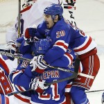 
              The New York Rangers celebrate after scoring in overtime to win 2-1 against the Washington Capitals during Game 5 in the second round of the NHL Stanley Cup hockey playoffs, Friday, May 8, 2015, in New York. (AP Photo/Julie Jacobson)
            