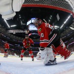 
              Chicago Blackhawks goalie Corey Crawford (50) and left wing Patrick Sharp (10) look at the puck after Tampa Bay Lightning center Cedric Paquette (13) scores a goal during the third period in Game 3 of the NHL hockey Stanley Cup Final on Monday, June 8, 2015, in Chicago. The Lightning won 3-2 to take a 2-1 lead in the series. (Bruce Bennett/Pool Photo via AP)
            