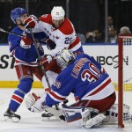 
              Washington Capitals left wing Jason Chimera (25) threatens as New York Rangers goalie Henrik Lundqvist (30), of Sweden, protects the crease during the first period of Game 5 in the second round of the NHL Stanley Cup hockey playoffs, Friday, May 8, 2015, in New York. (AP Photo/Kathy Willens)
            