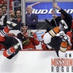 
              Chicago Blackhawks defenseman Kyle Cumiskey, left, and Anaheim Ducks left wing Matt Beleskey, right, go over the board into the Chicago bench during the second period in Game 4 of the Western Conference finals of the NHL hockey Stanley Cup playoffs, Saturday, May 23, 2015, in Chicago. (AP Photo/Nam Y. Huh)
            