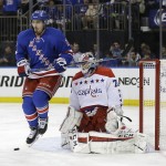 
              Washington Capitals goalie Braden Holtby (70) blocks a shot as New York Rangers left wing Chris Kreider (20) looks for the rebound during the second period of Game 1 in the second round of the NHL Stanley Cup hockey playoffs Thursday, April 30, 2015, in New York. (AP Photo/Frank Franklin II)
            
