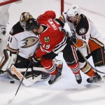 
              Anaheim Ducks goalie Frederik Andersen (31) stops a shot by Chicago Blackhawks center Jonathan Toews as Cam Fowler (4) defends during the third period in Game 4 of the Western Conference finals of the NHL hockey Stanley Cup playoffs, Saturday, May 23, 2015, in Chicago. (AP Photo/Charles Rex Arbogast)
            