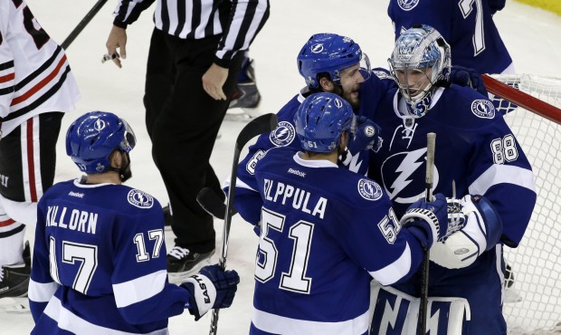 Tampa Bay Lightning players greet backup goalie Andrei Vasilevskiy after their win against the Chic...