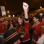 
              Chicago Blackhawks fans celebrate on Clark street in the Wrigleyville neighborhood after the Chicago Blackhawks won the Stanley Cup, defeating the Tampa Bay Lightning in Chicago on Monday, June 15, 2015.  (AP Photo/Paul Beaty)
            