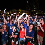 
              Fans in Curtis Hixon Park in Tampa, Fla., who braved the downpour, cheer in celebration of the Tampa Bay Lightning victory over the Chicago Blackhawks in Game 3 of the Stanley Cup Finals Monday, June 8, 2015. (Luis Santana/The Tampa Bay Times via AP)
            