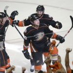 
              Anaheim Ducks' Hampus Lindholm,left, of Sweden, Matt Beleskey, center, and Kyle Palmieri, right, celebrate a goal by Beleskey against the Calgary Flames during the first period of Game 1 in the second round of the NHL Stanley Cup hockey playoffs, Thursday, April 30, 2015, in Anaheim, Calif. (AP Photo/Jae C. Hong)
            