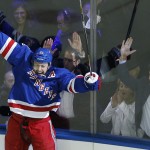               New York Rangers center Derek Stepan (21) reacts after scoring the winning goal against the Washington Capitals in overtime of Game 7 of the Eastern Conference semifinals during the NHL hockey Stanley Cup playoffs, Wednesday, May 13, 2015, in New York. The Rangers won 2-1. (AP Photo/Julie Jacobson)
            