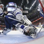 
              Tampa Bay Lightning's Anton Stralman, of Sweden, and goalie Andrei Vasilevskiy, right, watch as a shot by Chicago Blackhawks' Jonathan Toews scores during the second period in Game 4 of the NHL hockey Stanley Cup Final on Wednesday, June 10, 2015, in Chicago. (Bruce Bennett/Pool Photo via AP)
            