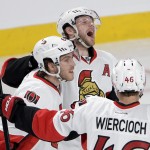 
              Ottawa Senators right wing Bobby Ryan, top, celebrates with teammates Mike Hoffman and Patrick Wiercioch after scoring against the Montreal Canadiens during the first period of Game 5 of a first-round NHL hockey playoff series, Friday, April 24, 2015, in Montreal. (Ryan Remiorz/The Canadian Press via AP)
            