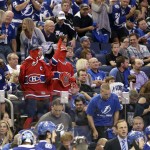 
              A pair of Montreal Canadiens fans dance among a sea of Tampa Bay Lightning fans during second period of Game 4 NHL second round playoff hockey action between the Tampa Bay Lightning and the Montreal Canadiens, Thursday, May 7, 2015, in Tampa, Fla. (AP Photo/Wilfredo Lee)
            