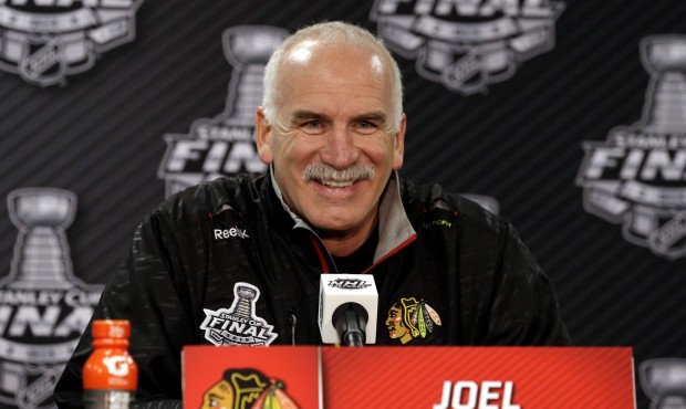 Chicago Blackhawks head coach Joel Quenneville smiles as he talks during a news conference, Sunday,...