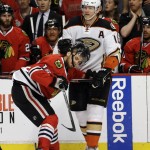 
              Anaheim Ducks right wing Corey Perry (10) takes the helmet off Chicago Blackhawks center Marcus Kruger (16) during the second period in Game 4 of the Western Conference finals of the NHL hockey Stanley Cup playoffs, Saturday, May 23, 2015, in Chicago. (AP Photo/Nam Y. Huh)
            