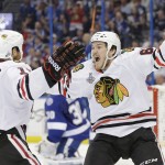 
              Chicago Blackhawks center Andrew Shaw,right,, celebrates his goal with Andrew Desjardins against the Tampa Bay Lightning during the second period in Game 2 of the NHL hockey Stanley Cup Final in Tampa, Fla., Saturday, June 6, 2015.  (AP Photo/Chris O'Meara)
            
