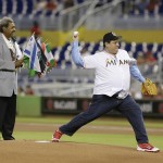 
              Mauricio Sulaiman, right, president of the World Boxing Council, throws out a ceremonial first pitch as boxing promoter Don King, left, looks on before the start of a baseball game between the Miami Marlins and the St. Louis Cardinals, Wednesday, June 24, 2015, in Miami. (AP Photo/Wilfredo Lee)
            