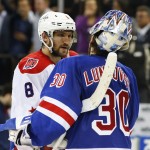 
              Washington Capitals left wing Alex Ovechkin (8) is greeted by New York Rangers goalie Henrik Lundqvist (30) after the Rangers won 2-1 in overtime in Game 7 of the Eastern Conference semifinals during the NHL hockey Stanley Cup playoffs, Wednesday, May 13, 2015, in New York. (AP Photo/Kathy Willens)
            