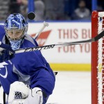 
              Tampa Bay Lightning goalie Ben Bishop blocks a shot during practice at the NHL hockey Stanley Cup Final, Friday, June 5, 2015, in Tampa, Fla. The Chicago Blackhawks lead the best-of-seven games series 1-0. Game 2 is scheduled for Saturday night. (AP Photo/Chris Carlson)
            