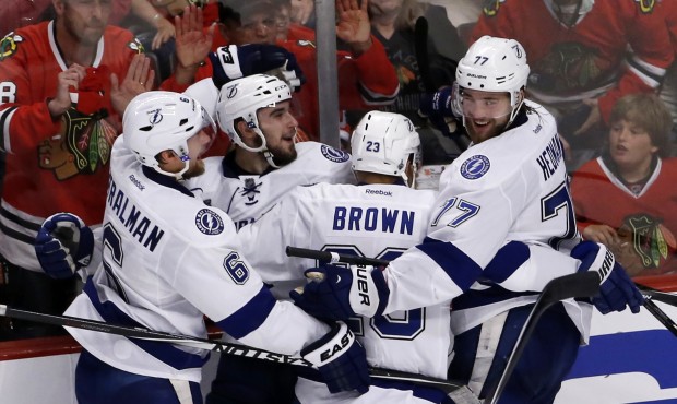 Tampa Bay Lightning’s Cedric Paquette, second from left, is congratulated teammates Anton Str...