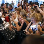               Fans take pictures of the Stanley Cup at the MGM Grand on Tuesday, June 23, 2015, in Las Vegas. If the NHL decides to gamble on an expansion franchise in the Nevada desert, most of the world's top hockey players are cautiously optimistic that the ice wouldn't melt. (AP Photo/John Locher)
            