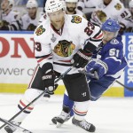 
              Chicago Blackhawks right wing Kris Versteeg (23) of Canada, left, shoots around Tampa Bay Lightning center Valtteri Filppula (51) of Finland, during the second period in Game 1 of the NHL hockey Stanley Cup Final in Tampa, Fla., Wednesday, June 3, 2015.  (AP Photo/Chris O'Meara)
            