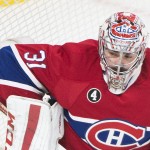 
              Montreal Canadiens goaltender Carey Price makes a save against the Ottawa Senators during the first period of Game 5 of a first-round NHL hockey playoff series, Friday, April 24, 2015, in Montreal. (Graham Hughes/The Canadian Press via AP)
            