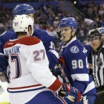 
              Tampa Bay Lightning center Vladislav Namestnikov (90) of Russia, and Montreal Canadiens center Alex Galchenyuk (27) jostle during third period of Game 4 NHL second round playoff hockey action, Thursday, May 7, 2015, in Tampa, Fla. The Canadiens defeated the Lightning 6-2. (AP Photo/Wilfredo Lee)
            