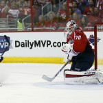 
              New York Rangers center Derick Brassard (16) watches his goal past Washington Capitals goalie Braden Holtby (70) during the second period of Game 4 in the second round of the NHL Stanley Cup hockey playoffs, Wednesday, May 6, 2015, in Washington. (AP Photo/Alex Brandon)
            
