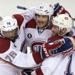
              Montreal Canadiens left wing Max Pacioretty,center, is congratulated by defenseman P.K. Subban, left, and center Torrey Mitchell, right, after Pacioretty scored during the first period of Game 4 of a second-round NHL Stanley Cup hockey playoff series against the Tampa Bay Lightning in Tampa, Fla., Thursday, May 7, 2015. (AP Photo/Phelan M. Ebenhack)
            