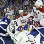 
              Tampa Bay Lightning goalie Andrei Vasilevskiy, left, of Russia, makes a save against Montreal Canadiens defenseman Andrei Markov, right, of Russia, during third period of Game 4 NHL second round playoff hockey action, Thursday, May 7, 2015, in Tampa, Fla. The Canadiens defeated the Lightning 6-2. (AP Photo/Wilfredo Lee)
            