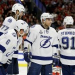 
              Members of the Tampa Bay Lightning, Anton Stralman (6), of Sweden, Victor Hedman (77), of Sweden, Valtteri Filppula (51), of Finland, and Steven Stamkos (91) pause during at timeout in the third period in Game 4 of the NHL hockey Stanley Cup Final against the Chicago Blackhawks Wednesday, June 10, 2015, in Chicago. (AP Photo/Nam Y. Huh)
            
