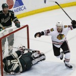
              Minnesota Wild defenseman Ryan Suter (20) watches as Chicago Blackhawks left wing Bryan Bickell (29) celebrates after Blackhawks right wing Patrick Kane scored on Wild goalie Devan Dubnyk (40) during the third period of Game 4 in the second round of the NHL Stanley Cup hockey playoffs, Thursday, May 7, 2015, in St. Paul, Minn. The Blackhawks won 4-3 to sweep the round. (AP Photo/Ann Heisenfelt)
            