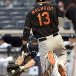 
              New York Yankees catcher Brian McCann, left, fields the throw as Baltimore Orioles' Manny Machado attempts to score on a single by Delmon Young during the first inning of a baseball game Friday, May 8, 2015, at Yankee Stadium in New York. Machado was tagged out on the play. (AP Photo/Bill Kostroun)
            
