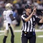 
              FILE - In this Aug. 16, 2013, file photo, NFL referee Sarah Thomas works the game in the second half of an NFL preseason football game between the New Orleans Saints and the Oakland Raiders at the Mercedes-Benz Superdome in New Orleans. Sarah Thomas is that much closer to taking the field as the NFL's first female official. She's part of a clinic for all refs with most training camps about two weeks away from opening. (AP Photo/Matthew Hinton, File)
            