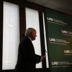 
              UAB President Ray Watts walks up to the microphone to speak during a news conference, Monday, June 1, 2015, in Birmingham, Ala. Watts is bringing the football program back. He told The Associated Press that he decided on Monday, June 1, 2015 to reverse the earlier decision after meetings with UAB supporters continued through the weekend. He says donors have pledged to make up the estimated $17.2 million deficit over the next five years if football is restored. Monday, June 1, 2015, in Birmingham, Ala.(AP Photo/Brynn Anderson)
            