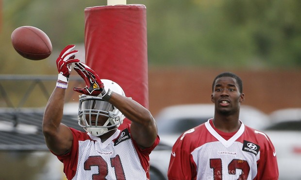 Arizona Cardinals’ David Johnson (31) tries to make a catch on a football before going out of...