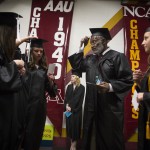 
              Former University of Minnesota and Pro Football Hall of Famer Bobby Bell fixes his tassel with a group of fellow graduating students as they line up for the procession before graduating college, Thursday, May 14, 2015, at Mariucci Arena at the University of Minnesota in Minneapolis. Fifty-two years after he left campus for pro football, Bell returned to earn his degree in parks, recreation and leisure studies and walk in graduation ceremonies on Thursday. (Renee Jones Schneider/Star Tribune via AP)  MANDATORY CREDIT; ST. PAUL PIONEER PRESS OUT; MAGS OUT; TWIN CITIES LOCAL TELEVISION OUT
            